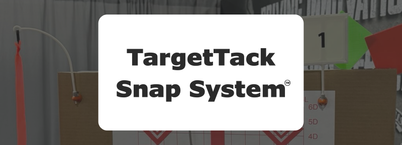 TargetTack Snap System with display from SHOT Show 2025 in background.