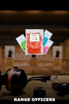 Colorful packages of ammunition on a shooting range with 'Range Officers' text.