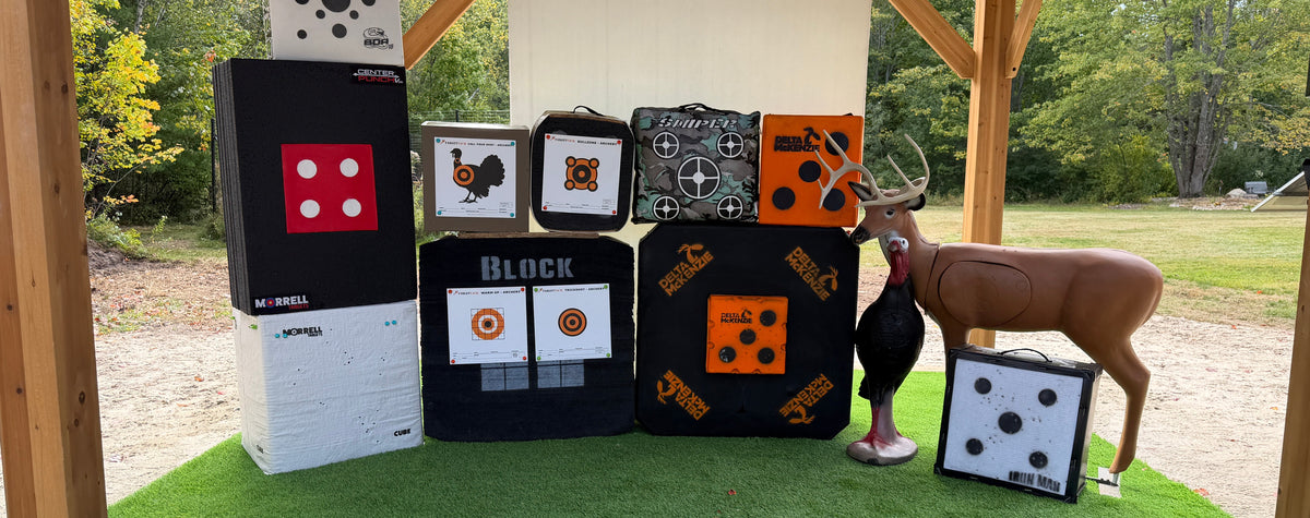 Ben's backyard range under a gazebo with a variety of archery backstops from Delta McKenzie, BIGshot Targets, Morrell Targets, and Feradyne set up with TargetTack archery pins and TargetTack paper targets.